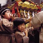 One of Japan's most honored traditions is the Omikoshi Matsuri, the annual Shinto festival. Nearly every Shinto shrine in Japan holds a mikoshi parade, in which a miniature replica of the shrine containing an image of the honored deity is transported through the surrounding streets on the shoulders of local patrons. Depicted here is a youthful version of a traditional mikoshi parade.
