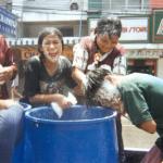 A young man gets the dreaded powder treatment from his friends.
