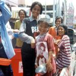 These children don't care if they're all wet and streaked with powder - it's Songkran time!