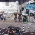 Colourful trishaws parked waiting for fares.